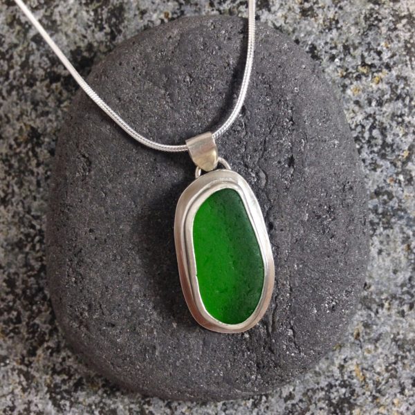 Emerald Green bezelled Guernsey sea glass & sterling silver pendant.