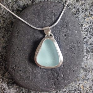 Pale Blue bezelled Guernsey sea glass & sterling silver pendant.