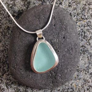 Pale Turquoise bezelled Guernsey sea glass & sterling silver pendant.