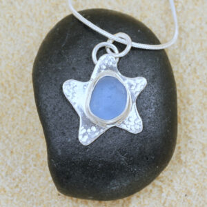 Handcrafted sterling silver starfish with pale blue Guernsey seagrass.