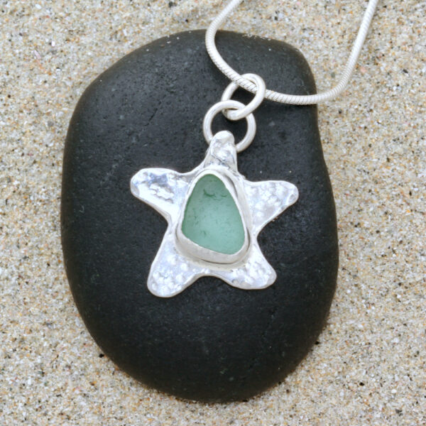 Seafoam Green bezelled Guernsey sea glass & sterling silver starfish pendant.